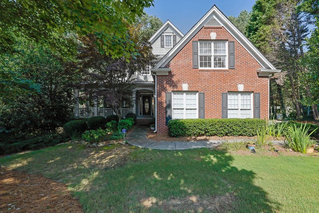 Welcome to this beautifully appointed home located in the sought-after Hamilton Mill community. Featuring timeless hardwood flooring and coffered ceilings that add a touch of sophistication, this spacious residence offers the perfect blend of comfort and style. The formal dining room is ideal for entertaining, while the chef’s kitchen boasts generous counter space and overlooks the inviting family room—perfect for everyday living and gatherings. Enjoy serene views from the back deck, which overlooks a wooded backyard and a tranquil creek, offering privacy and a peaceful retreat. Inside, the laundry room is thoughtfully designed with built-in storage and expansive countertop space for convenience. The primary suite is a true sanctuary with a recently renovated spa-like bathroom featuring a stand-alone soaking tub and a custom tiled walk-in shower. The finished basement offers flexible living space, including an additional bedroom, full bath, and living area—ideal for guests, in-laws, or a private retreat. Step outside to the covered patio, perfect for outdoor entertaining year-round. Seller is offering a $10,000 allowance toward paint and carpet—allowing you to make this home your own! Don’t miss this exceptional opportunity to live in one of Gwinnett County’s premier communities with top-rated schools, amenities, and easy access to shopping and highways.