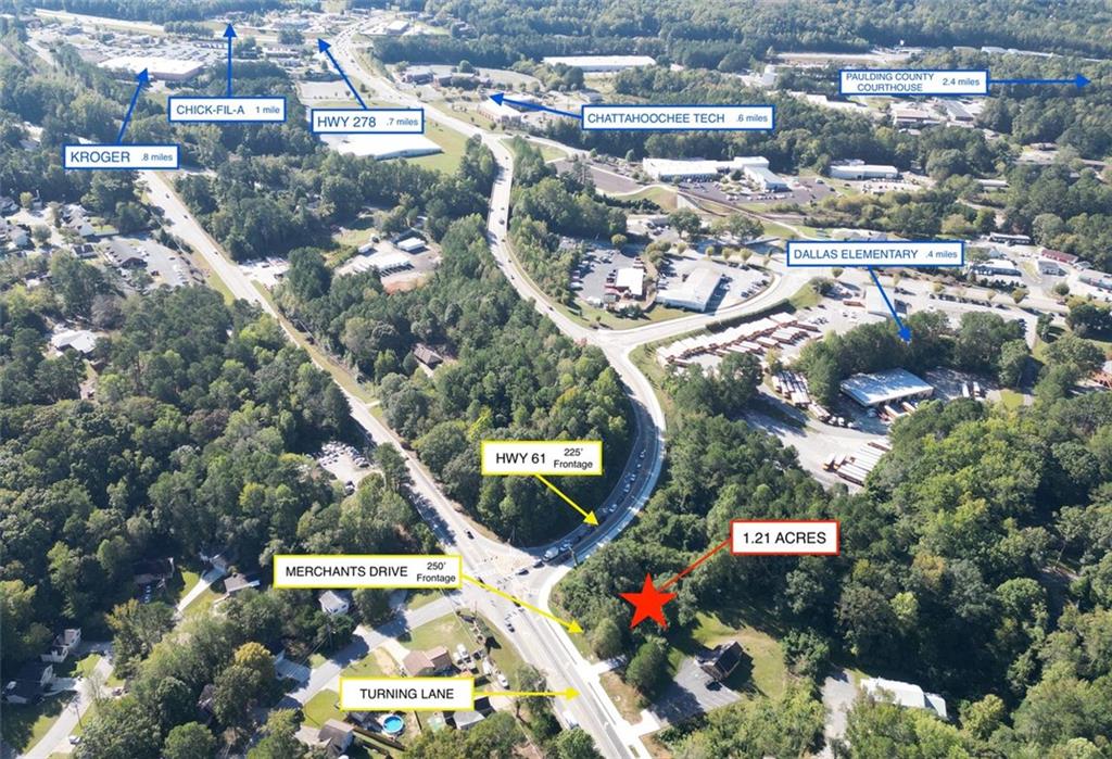 Flexible C-1 Zoned Property on a High-Traffic Signaled Corner Rare opportunity for a high-traffic, signaled corner property already zoned C-1 Commercial. 250' road frontage on Merchants Drive with a turn lane and 225' of frontage on Hwy 61/Nathan Dean Blvd. Possible uses include a car wash, auto lot, daycare, retail, drive-through restaurant, offices, and more. Average Daily Traffic is 18,400. Existing 1,136 square foot building is currently in use as an office space with three offices, a full kitchen, and one full bath. Property is adjacent to a Paulding County School property, so would not be approved for any business that sells alcohol.