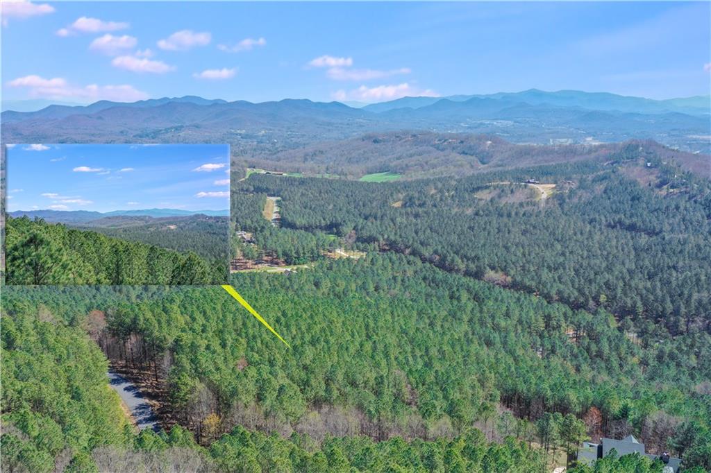 MOUNTAIN views are stunning in the Thirteen Hundred community located in the PICTURESQUE TOWN of Blairsville. This acreage is located in the separately gated OVERLOOK section. A WEALTH OF AMENITIES await as you begin your unforgettable move to PEACE and NATURE. SERENE parks, trails by the CREEK and HORSES grazing by the stables greet you as you enter the community. LONG RANGE, LAYERED VIEWS are visible from this overlook lot aptly located on MILE HIGH lane. Equally incredible views are seen from the clubhouse POOL complete with outdoor kitchen and GATHERING area. Multiple BUILDING SITES on this property depending on whether you prefer a SLEEPING PORCH, screen porch or covered deck to take in the blue skies, sunshine and MOONLIT nights of beautiful North Georgia. Along with your saddle and sunscreen, bring your boat or fishing pole for access to LAKE NOTTELY included within the community.