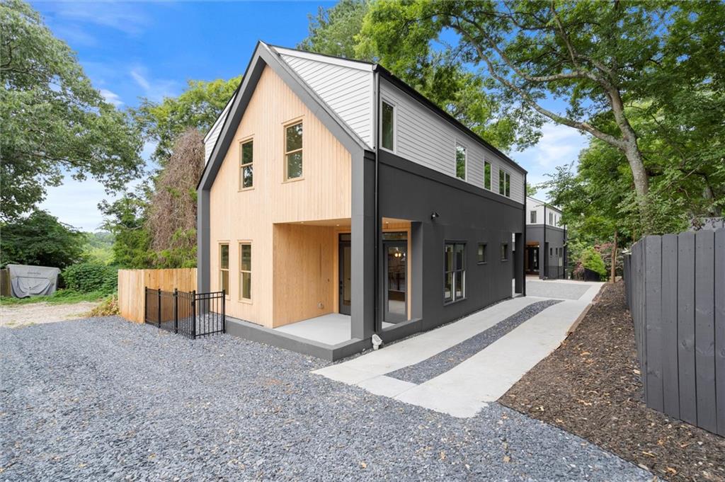 Scandinavian inspired Belt-Line adjacent 5 Bedroom/4 Bath home with white oak floors throughout in Grant Park built by Grit City. EcoChef Certified Kitchen includes Thermador appliances including an induction range, fully custom cabinetry, cambria countertops and large island. The main floor has 10’ Ceilings and 8’ doors with a large fireplace, open living and dining areas, large walk-in pantry with wine cooler, drop zone, office/bedroom, full bath, covered rear patio and fenced in rear yard area. The upstairs includes a den, primary suite with two walk-in closets and tiled Primary bath with Large Shower, free-standing tub, two vanities and electronic toilet, 3 additional bedrooms - one ensuite and the other two with a jack-n-jill bath, and laundry room. The two-car garage is EV Car Charger ready. This alley accessed home is two doors down from Beltline entrance.