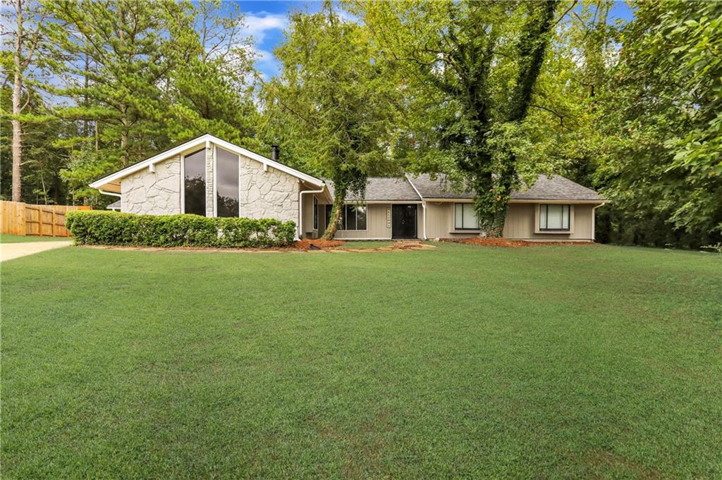 Available for Virtual Tours Only! Move-ins within one week of approval receive the rest of the current month RENT-FREE! Reduced $1000 flat security deposit plus one free month on a 13-month lease, if qualified. First full month receives rent concession. This is a rare ranch with 5 bedroom and 2.5 baths located in Stone Mountains conveniently located near interstate and a pond. this home has it all. your entry into the formal livingroom and leads into formal diningroom with elegant light fixture and large table. The front room can fit any furniture you havr and has tons of natural light and a heating stove. The upgraded whitr kitchen with Stainless Steel appliances, granite countertops and upgraded sink faucet with eat in kitchen. Spacious laundry room attached to half bath leading into a bedroom with sliding doors going to enclosed patio and deck. There is a second den with fireplace ready for your family and friends. There is an additional 4 bedrooms including a large master with walk in closet and shower tub combo in master bath. All bedrooms large enough for Queen set and one bedroom has bookshelf and another a desk ready for you to work.. DONT WAIT ON THIS ONE! Excalibur Homes does not advertise on Facebook or Craigslist. Be advised that the sq ft and other features provided may be approximate. Prices and/or availability dates may change without notice. Lease terms 12 months or longer. Application fee is a non-refundable $75 per adult over 18 years of age. One-time $200 Administrative fee due at move-in. Most homes are pet-friendly. Breed restrictions may apply. Rental insurance required.
