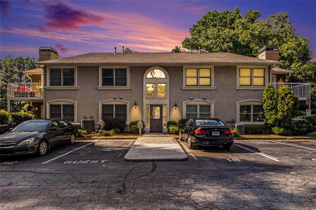 This beautiful Brookhaven condo is the most spacious one-bedroom you can find! Fantastic open floorplan includes the kitchen with breakfast bar; dining, living and sunny den areas, large bedroom and bath, utility room and foyer. You will love the stylish upgrades: stunning wood acoustic panels on walls, bright new lighting, built-in cabinets and shelving, luxury flooring; fresh paint, and a beautifully-renovated bathroom and tiled shower. With the best location in the community, your sunroom and porch have the best natural views, and the concrete porch is large enough for entertaining and a patio garden. This great home also has its own parking space and a storage room right next to the condo. Great community amenities, too: pool, grilling area, pet park, and ample guest parking. You can walk or roll to restaurants and retail and Executive Park. LaVista Park is one of the best locations in metro Atlanta; Chantilly Station is just minutes from CHOA, I-85, Emory, Lenox, and everywhere you want to be. You WILL love it here!