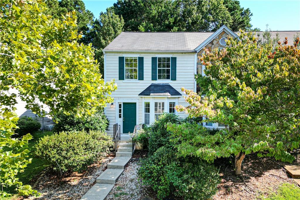 Move-in ready! This 2 beds / 2.5 baths end-unit townhome in Roswell is a true gem! Enjoy new paint, new carpet, and new luxury vinyl plank flooring throughout, creating a bright and inviting atmosphere. The open floor plan features a white kitchen with a breakfast bar and pantry, flowing into the spacious family room with a cozy fireplace. Upstairs, a roommate-style layout offers two generous bedrooms with private baths and convenient laundry access. Situated on a corner lot with a private deck and level driveway, this home is both practical and charming. Ideal for first-time buyers or investors—with NO active HOA and NO rental restrictions. All just minutes from downtown Roswell, shopping, dining, and great schools.