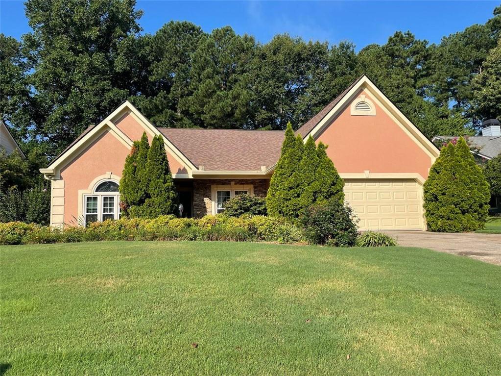 Charming Ranch Home with Major Updates & Incredible Value! Welcome to this beautifully maintained ranch-style home that blends comfort, convenience, and peace of mind! With exceptional curb appeal and a long list of big-ticket updates already done—including a newer roof, windows, HVAC, water heater and solar panels allowing you to move in with confidence. Inside, you'll find a spacious layout featuring formal living room and dining room, into a great kitchen with ample storage open to a family room with cozy fireplace. There is a large owner’s suite with a full ensuite bath and a flexible sitting area that can easily be converted into a fourth bedroom or home office. Two additional bedrooms provide plenty of space for guests or family. Enjoy super low energy bills thanks to owned solar panels, and relax year-round in the bright and inviting sunroom overlooking the large, private backyard—perfect for entertaining, gardening, or simply unwinding. This home offers easy, single-level living with thoughtful upgrades and room to grow. Don't miss this opportunity—schedule your showing today!