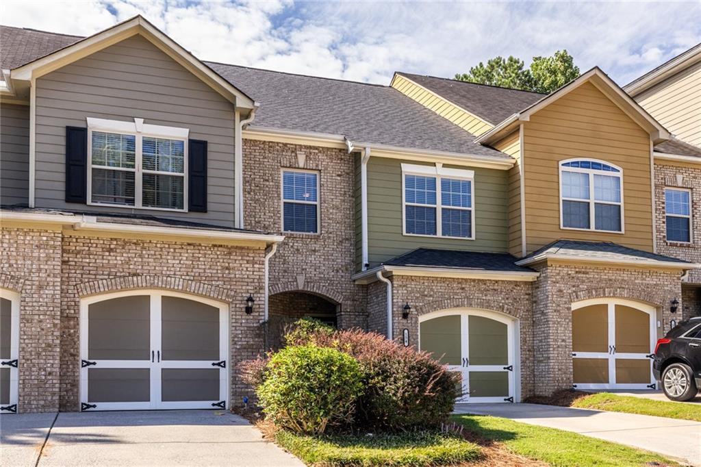 Take a look at this well-maintained, move-in-ready townhome located within 2 miles of shopping, restaurants, and entertainment. Upon entering the main level, you will find a half bath and a large storage closet, a large open concept living space with a fireplace, a built-in entertainment center with bookshelves, a kitchen with granite countertops, and stainless steel appliances. Upstairs, you will find a large bonus area with plenty of room to use as an office, a secondary bedroom and full secondary bathroom, a centrally located laundry closet, and the large primary suite.
This home features an adorable fenced-in backyard/patio, offering some privacy since no other homes back up to the yard. The house has a new roof and fresh exterior paint. The HVAC was replaced in 2019. You don't want to miss this one.