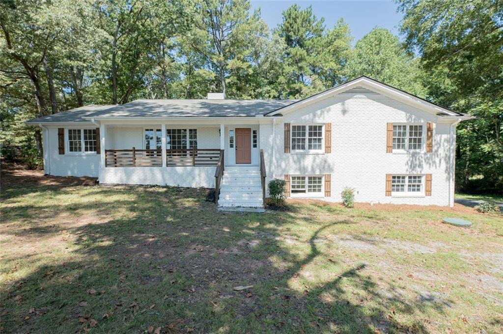 Welcome to your charming Marietta retreat! This fully renovated four-sided brick Ranch on 0.8 acres is just minutes from historic Marietta
Square, shopping, dining, and major highways. Step inside to a modern oasis with new appliances, cabinets, and refinished hardwoods.
The all-new-electric HVAC system and water heater ensure efficiency. The kitchen, with granite countertops, opens to a spacious dining
room. Enjoy natural light in the oversized living room and find comfort in the renovated bathrooms with tile floors and new vanities. The
home sits back from the street, surrounded by mature trees and a huge magnolia tree for added privacy. The large driveway and no HOA
provide convenience. The full partially finished basement features a bedroom with a fireplace, and a full bathroom. Recent upgrades
include a new electrical panel, meter, and roof. With the home on septic (recently pumped) and sewer available in the street, practicality
meets luxury. Don't miss this opportunity to own a beautiful home near Marietta Square. Contact us for a tour today!