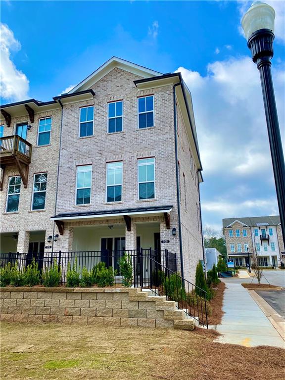 Brand New Construction- You Will Be the First To Occupy. Executive Upgraded-3 bedroom 2.5 bath- 3 Level Brick Exterior Townhome- End Unit- Gated Community of Atley Located In Downtown Alpharetta- Community Features: Swimming Pool, Dog Park and Alpha Loop Runs Through. Easy Access to Avalon, Northpoint Mall, I-400. Ground Level Features a Large 2 Car Garage on One Side and Main Entrance w/ Gated Fenced in Front Yard with Large Patio Perfect for Entertaining. Entrance Opens Into a Large Flex Room that Could Be Used as a Den/Media Room/Office etc 2nd Level Features a Large Living Room with upgraded Stone Fireplace, Entertaining Space off a Huge Open Modern Kitchen with Island, White Cabinets and Stainless Steel Appliances. Additional Room Behind Kitchen Perfect for a Sunroom/Den/Playroom/Office with a 1/2 bath, Laundry Room (Washer Dryer Connections Only) and a Large Deck. 3rd Level Features all 3 bedrooms- Master Suite is Huge with His/Hers Closets and a Spa Like Bathroom with an Extended Spa Shower. Secondary. Bedrooms Share a Private Deck and a Full Hall Bath (Shower Only). Trash Service Included.