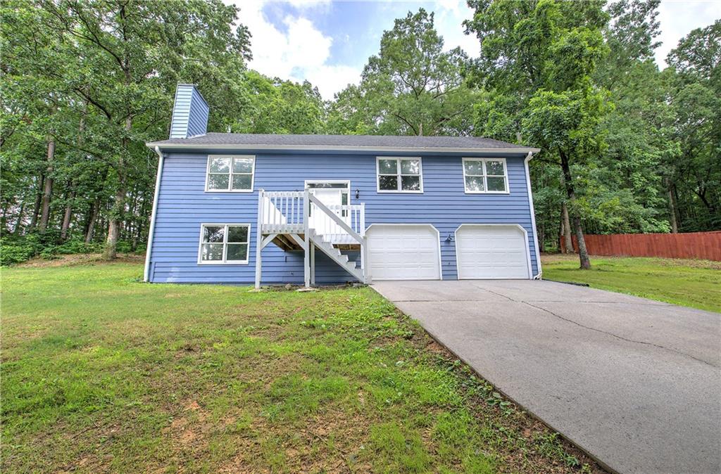 Welcome Home to 17 Fawn Ridge Drive! This beautifully remodeled 4-bedroom, 2-bathroom home offers a perfect blend of comfort and style. The spacious primary suite is conveniently located on the main level, providing ease and privacy. Enjoy cozy evenings by the fireplace, or entertain in the fully finished basement, ideal for a media room, home office, or play area. The home features a mix of hardwood and carpet flooring throughout, adding warmth and character to every room. With two garages, there’s plenty of space for parking and storage. 17 Fawn Ridge Drive offers charm, function, and space for your lifestyle. Don’t miss this move-in-ready gem—schedule your private tour today!