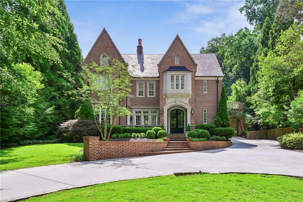 This splendid Haynes Manor home was designed by renowned Atlanta architect Brian Bethea Smith and custom built in 2002. Since then it has been renovated to meet the highest standards of style and comfort. The main house enjoys 5 bedrooms, 5 full baths and 3 half baths, while the guest house accommodates a 6th bedroom and additional full bath. 

The main level of the home includes an inviting front hall flanked by a gracious fireside living room  and a dining room seating 12+ with secret staircase to the wine cellar in the terrace level and a butler’s pantry leading to the kitchen. Flexibility for working from home is created by a handsome paneled study, and music lovers can enjoy the piano room which opens to a delightful terrace. A stunning powder room is conveniently located off of the main floor hallway.

The gorgeous top-of-line kitchen, with vaulted beamed ceiling, is anchored by a huge island and has tons of storage including a walk-in pantry. There is also a  spacious breakfast area, perfect for family meals, and an adjacent  mudroom, and half bath. The kitchen opens to the warm fireside family room which is full of custom built-ins and lined with French doors to the covered stone patio and grill. 

The expanded and renovated upper floor owners’ suite offers a very spacious bed chamber with access to a large covered porch. The adjoining owner’s bath with beautiful marble finishes includes a double vanity, massive shower and freestanding tub. The owners’ closets (four in all) are truly impressive, especially the two walk-ins off of the bath. There is an expanded and newly renovated laundry room with double washer and dryer units plus three gracious secondary bedroom suites on the upper floor. 

The fully finished terrace level features some really fun spaces including a wine cellar with tasting room, gym, billiard area, large family room, home theatre and bedroom suite. 

The extremely private .87+- acre lot is professionally landscaped and fenced. The back yard has a beautiful pool surrounded by artificial turf and a five-hole putting green. The guest house includes a totally remodeled guest suite above the two-car garage, plus extra storage bay and workshop.

Recent improvements include refinishing all of the home’s beautiful hardwood floors, a fully updated WIFI network covering every corner of the main house, garage suite and yard. In addition, the main level HVAC system was replaced in 2023 and the home’s security system has been upgraded by Linder Security to include 6 exterior security cameras.