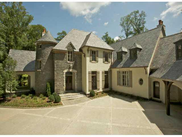 Price reduced $1,000,000. European style estate located on one of Atlanta's premier streets. Design by Duane Stone, constructed by Bradwell Prop. 12'+ ceilings, spacious kitchen w/keeping room, mstr suite on main, his/her mstr bath, 3 car garage, elevator, 4 HVAC zones, slate roof & beautiful pool.