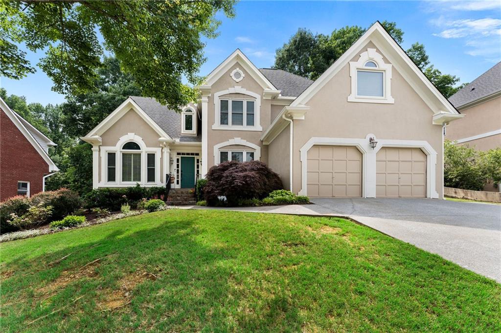Welcome to this Spacious Multigenerational Home nestled in the sought after Brookstone Country Club community close to Parks, Bike/Hiking Trails, Shopping, Dining, and Sought after schools. This home offers a blend of space and functionality, perfectly situated in the heart of West Cobb's preferred area. The home features a 2-story foyer with hardwood floors in the formal dining, formal living/office and leading to the family room with a stone fireplace, open to a sunny breakfast room and kitchen with stainless appliances. The primary suite is located on the main level, ideal for easy living, and features a walk-in closet while the primary bath features a double vanity and separate tub and shower. Upstairs you will find a loft with three secondary bedrooms that are generously sized and carpeted with walk in closets. Venture downstairs to the fully finished basement that is a true highlight, featuring a second kitchen, generous living room, media room, bonus room, bedroom, and full bathroom-making it perfect for extended family or hosting possibilities. Enjoy outdoor privacy on the oversized deck and fully fenced backyard, ideal for entertaining or relaxing outdoors. With it's versatile layout, superb location, and community amenities featuring a Country Club, Golf, and Swim/Tennis options, this home truly has it all!