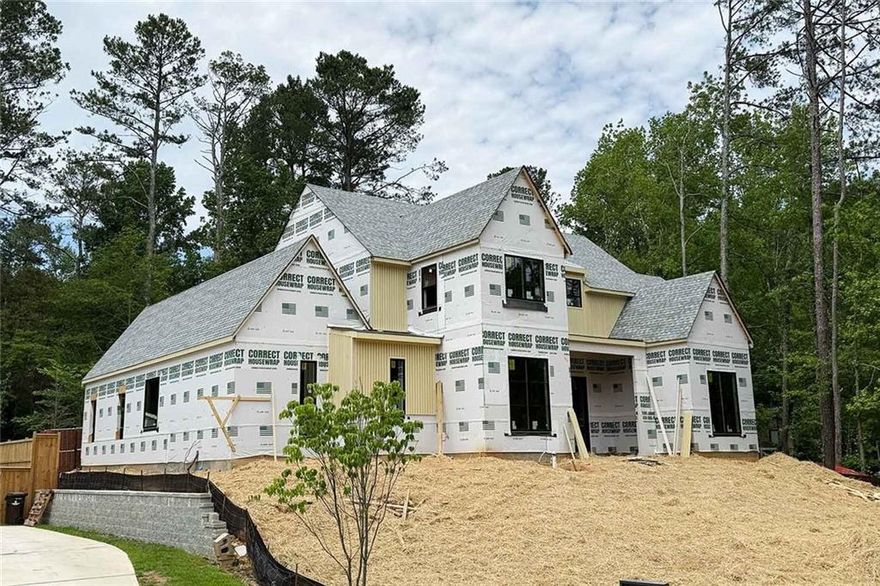 ** ANOTHER BEAUTIFUL NEW CONSTRUCTION HOME BUILT BY MODERNIZE PROPERTIES IN WALKABLE DOWNTOWN ALPHARETTA ** 12 foot ceilings throughout main level. Stunning covered outdoor living space with built-in kitchen. Perfect pool lot with ultimate privacy. Primary bedroom on main with soaring vaulted ceiling. Additional guest suite on main with private bath. Open floor plan with oversized kitchen island, scullery, lots of cabinets. Large sliding glass doors from family room to outdoor oasis. Second story with vaulted loft, 3 bedrooms with private baths, huge bonus room with full bath and closet that could be 4th bedroom/ home theater/ workout room/ home office etc. Luxury finishes throughout. 3-car garage. Spray foam insulation. Tankless water heater. Still time to make selections. Completion late summer.