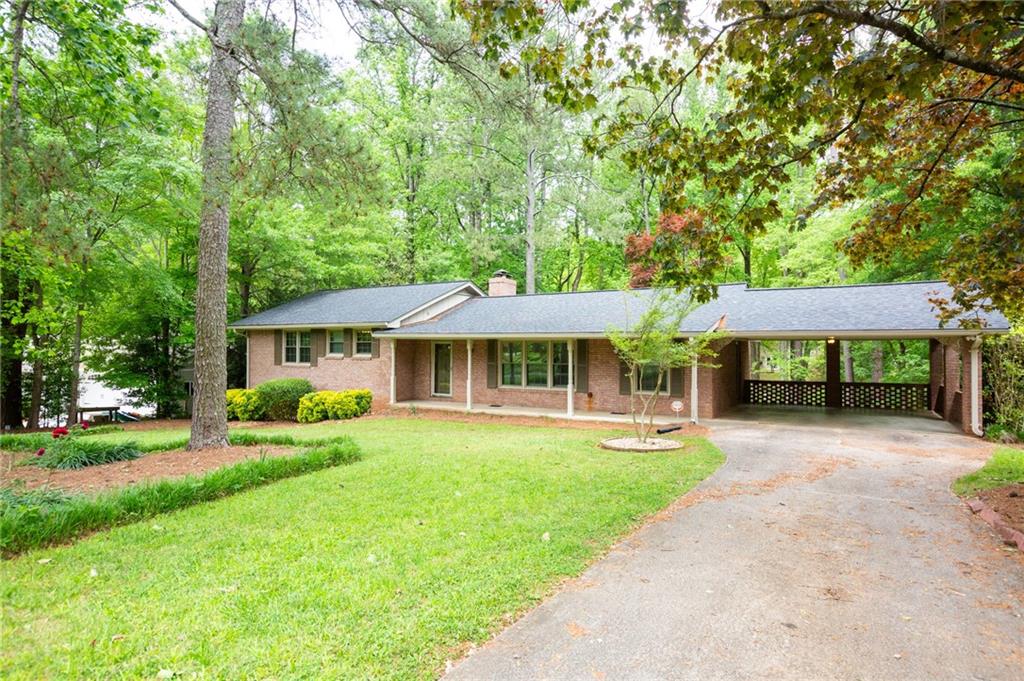 Beautiful 4 sided brick ranch in sought after "Briarmoor Manor", minutes from 85 or 285. Featuring 4 BR's/3 full baths. Sits on 1/2 acre lvl lot. Bright inviting LR/DR combo. Casual cozy FR w fplc opens up to screened in sunroom/deck & views to kitchen. Updated open concept kitchen w granite & bkfst bar. Kitche back door leads to carport, Basement is finished w huge rec space, 1 BR & 1BA & lg unfinished storage area. Real hdwds throughout, huge fenced in back ard, newer roof, gutters, & water heater. Very well taken care of! Pool and swim team. lawn maintenance and W/D included.