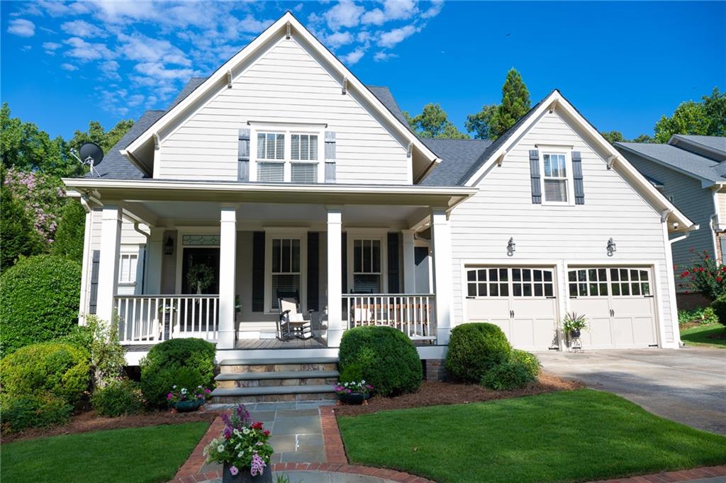 Luxury living meets thoughtful design in premier Marietta location.
Tucked away in a peaceful cul-de-sac just minutes from both the vibrant energy of Marietta Square and the tranquil trails of Kennesaw Mountain, this custom-built, beautifully appointed home offers the perfect blend of luxury, comfort, and convenience. Designed with entertaining and relaxation in mind, this property is a true retreat—indoors and out.
A wide rocking-chair front porch welcomes you into the main level, where 9-foot ceilings, abundant natural light, and gleaming hardwood floors create an inviting, open atmosphere. The formal dining room flows seamlessly into a spacious living area, kitchen, and breakfast room—ideal for gatherings large or small.
The kitchen is both stylish and highly functional, featuring custom cabinetry, Carrara marble countertops, a massive island with leathered black granite, and a complementary walnut butcher block breakfast bar. High-end appliances include double ovens and a gas cooktop. The adjacent family room centers around a beautiful stone gas-log fireplace, offering a warm and welcoming space to relax.
Step through to the showstopping screened porch, complete with wood-look tile, a coffered ceiling, and a wood-burning fireplace—perfect for year-round enjoyment. Just beyond, the connected deck features Brazilian Ipe wood flooring and a built-in Viking gas grill, all overlooking a meticulously landscaped backyard with stone pathways and a custom firepit area.
The main-floor primary suite is a peaceful retreat, featuring a large custom walk-in closet and a spa-inspired ensuite bath with heated Carrara marble floors, a luxurious soaking tub, an oversized walk-in shower, and dual vanities.
Upstairs, you’ll find three generously sized bedrooms with large closets, two full bathrooms, and a spacious bonus room ideal for a playroom, media room, or office.
The finished terrace level is a standout, offering hardwood and polished concrete floors, a full kitchen, a steam shower bath, a home gym, a great room, and a flexible space perfect for a guest suite or office. The basement opens onto a slate patio and the fully fenced backyard—your own private oasis.
Additional features include a two-car garage and a large driveway that provides ample parking for guests.
This exceptional home combines timeless elegance with everyday practicality in one of Marietta’s most desirable locations. A rare find—schedule your private showing today.