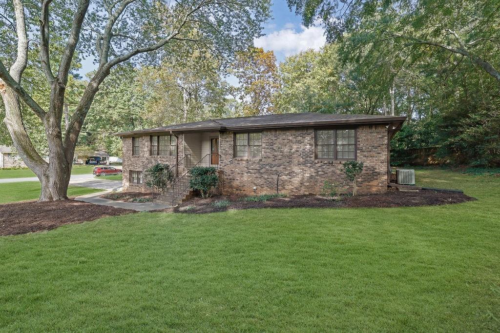 Located in the established Kingsridge subdivision in Woodstock, GA, this beautifully maintained 4-bedroom, 2-bath ranch-style home sits on a 0.45-acre corner lot and offers timeless four-sided brick construction with an unfinished basement. Inside, you’ll find new carpet and fresh paint throughout, creating a move-in-ready feel.
The large eat-in kitchen overlooks a spacious added family room filled with natural light from numerous windows, while plantation shutters add a touch of classic charm. The home also includes a separate dining room and a living room that can easily serve as a home office. Bedrooms are nicely sized, offering comfort and flexibility for family or guests.
The basement features a garage combination with three rooms equipped with HVAC vents, providing excellent potential for a workshop, gym, or additional living space.
Conveniently located near top-rated Woodstock schools and great shopping, this home combines quality construction, thoughtful updates, and a fantastic location. Schedule your showing today!