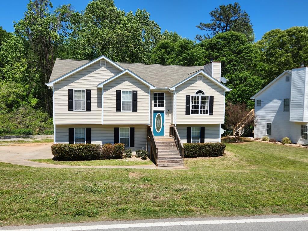 Wonderful lakeside residence featuring a private single-slip dock, ideally located near Northeast Georgia Medical Center, the Lake Lanier Olympic Rowing Venue and park, premier shopping, and fine dining. Zoned for the highly regarded North Hall Schools. This home has been freshly painted and new carpet making it move-in ready. Enjoy the rare opportunity to reside on the lake while remaining within easy reach of city conveniences. A gentle stroll leads to the water's edge, where the serene cove offers the perfect setting for kayaking, fishing, and small power boating. Now available. Pets under 30 lbs considered upon approval.