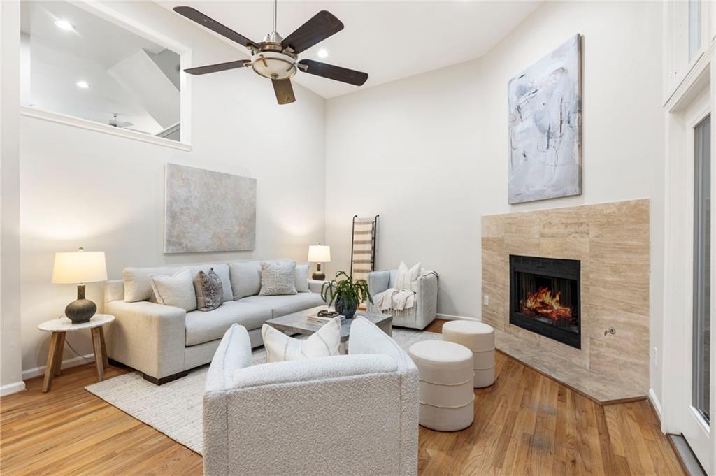 Nestled in the heart of Buckhead, this beautifully maintained townhome offers the perfect blend of comfort and convenience. With close proximity to some of Atlanta’s favorite restaurants, Chastain Park, and the Blue Heron Nature Preserve, this home sits in a prime Buckhead location. Step inside the townhome to soaring vaulted ceilings in the entryway, immediately creating an airy, open feel. In the main living space, the family room is anchored by a cozy fireplace and opens to a private patio—an ideal setup for both relaxing and entertaining. Off the family room, a kitchen and dining room flow seamlessly for an easy layout. A convenient half bath completes the main level. Upstairs, you’ll find a true owner’s suite featuring a walk-in closet and spacious bathroom, along with two additional bedrooms that share a full bath. Wood floors throughout add warmth and ease of maintenance, while fresh paint gives the home a move-in ready appeal. Additional highlights include a two-car garage and ample storage. With only seven other units, this townhome community offers both privacy and a welcoming neighborhood feel. Welcome home to this spacious and move-in ready Buckhead Townhome!
