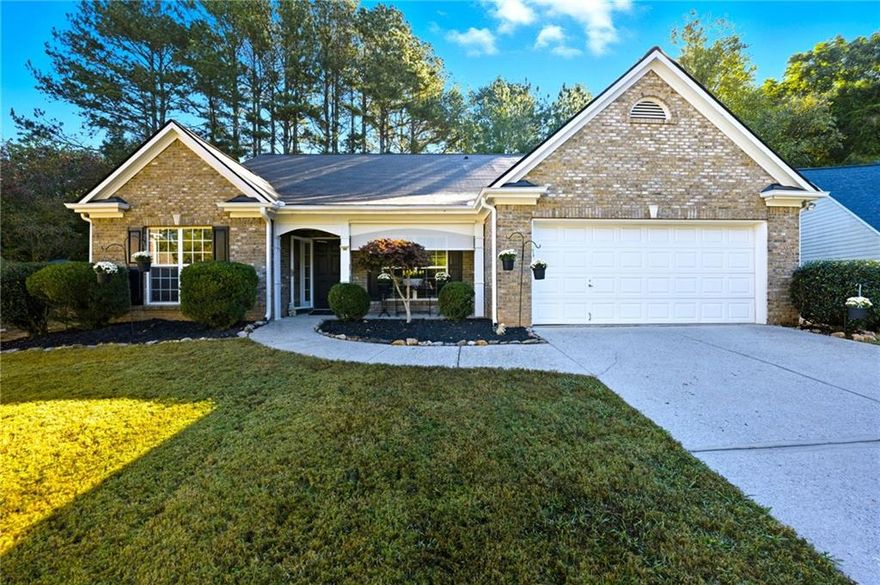 Impeccably updated and ideally situated, this stunning 4-bedroom home in Dawsonville offers a blend of style and sanctuary, perfectly positioned on a quiet cul-de-sac on a private, half-acre lot. This home is completely step-free (or features a zero-entry design) with gorgeous, low-maintenance luxury vinyl plank flooring flowing throughout for effortless living. The heart of the house is the beautifully renovated kitchen, featuring sleek white cabinetry, sparkling quartz countertops, and high-end smart appliances. For ultimate peace of mind, the property includes a whole-house generator. With a wooded backyard providing a peaceful, private retreat, this property delivers both elegance and tranquility, all while maintaining excellent access to GA-400, the North Georgia Premium Outlets, and the area's scenic mountain and lake attractions.