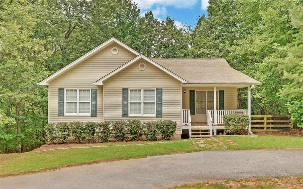 Charming Ranch Home on 1 Acre just Minutes from Downtown Dahlonega! Don’t miss this fantastic opportunity to own a spacious ranch-style home perfectly situated on a beautiful 1-acre lot, just minutes from charming Downtown Dahlonega and with quick, convenient access to GA 400. The main level features three bedrooms and two full bathrooms, offering a comfortable layout for everyday living. Downstairs, you’ll find a fully finished basement complete with a finished bathroom, an expansive great room, and an additional finished room, perfect for a home office, gym, media room, or guest space. This versatile layout offers endless possibilities for your needs. If you’re searching for a full-time residence or an investment property with rental income potential, this home is a solid choice. Priced competitively to allow the new owner the opportunity to make upgrades and add value, this property is a true find in a sought-after location.