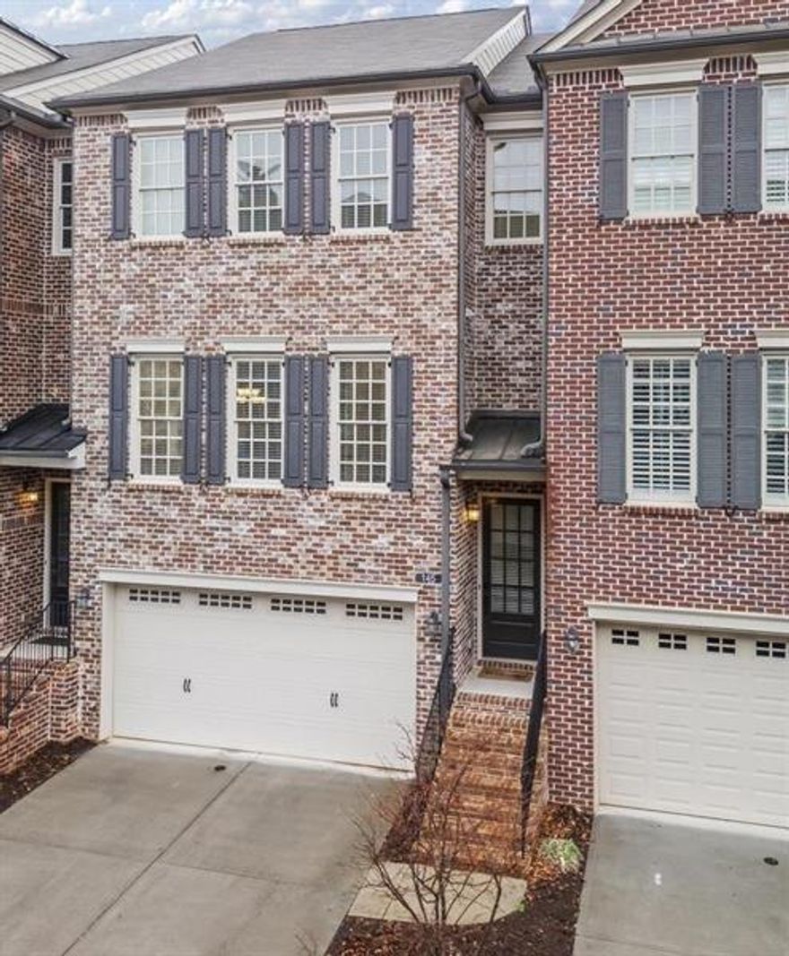 Discover this stunning townhome in The Georgian perfectly situated in the vibrant heart of Alpharetta, GA.  Enjoy open concept living with a spacious island Kitchen featuring Granite Counter Tops, Stainless Steel oven, warming drawer, 5 burning gas cooktop, refrigerator, dishwasher and large pantry.  Charming Dining Room and Fireside Great Room with niches providing more room for your d cor plus a private half bath.   Hardwood flooring throughout the main level and new carpet in all the bedrooms.   Luxurious Owners Suite enjoys a large tile bathroom with soaking tub, large corner shower, granite double vanity plus an enormous walk-in closet.  The guest suite enjoys another large walk-in closet plus a private tile bathroom.  On the terrace level is a large guest suite or recreation room plus a private tile bath and walk in closet.  This townhome features two decks overlooking private common area, the lower deck walks out to rear yard.  Spacious two car garage.  Easy Living in The Georgian, hassle-free lifestyle with the HOA maintaining the exterior will allow freedom to enjoy Awesome Alpharetta with all the restaurants, shopping, Alpha Loop, the Farmer's Market and so much more!