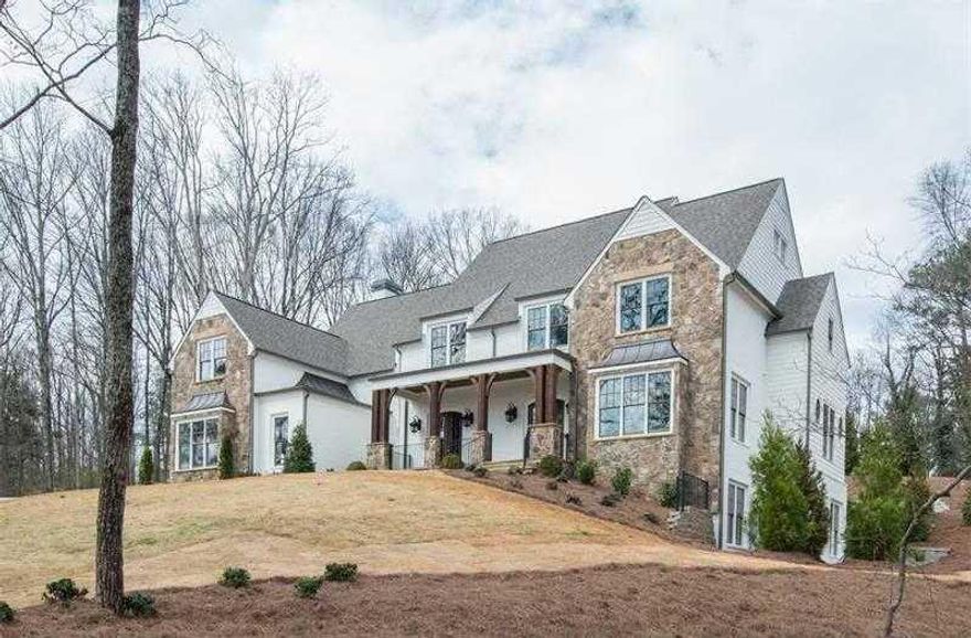 See this Old World rustic traditional Bill Harrison design with clean lines throughout. This Stone and Brick home is both elegant and sophisticated living on over an acre. Gourmet Kitchen features Sub Zero, Bosch, and Wolfe. Large kitch island w/ both a hidden walk in double pantry leading to separate dining rm w/ floor to ceiling molding. Home has elevator shaft, hwds thruout, master ste w oversized spa bath features cathedral ceilings, 2 wet bars w/ wine fridge, walk out from main to a large stone patio and perfectly flat backyard-a setting for pool.