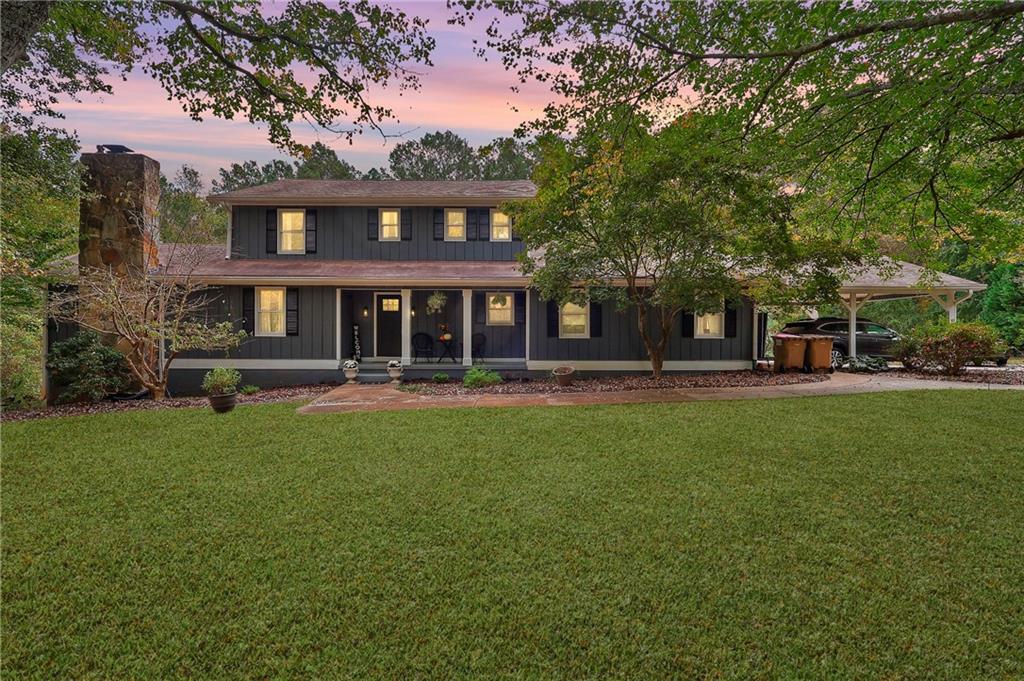 This stunning 5-bedroom, 4-bath farmhouse sits on 1.1 beautiful acres and offers an exceptional blend of custom design and modern comfort. The heart of the home is a professionally designed gourmet kitchen featuring a gas cooktop, double ovens, two dishwashers, built in microwave, an expansive custom-built pantry, and a large island with abundant seating. Sunlit windows surround the space, which flows seamlessly into the formal dining room and an impressive, window-filled great room with a stone fireplace. From there, step onto the screened porch-perfect for relaxing or entertaining. The main-level owner's suite includes a separate vanity area and spacious layout. An additional main-level suite (ideal for guests or in-laws) offers a full tile bath and private sitting area, plus a separate private entry. Upstairs, you'll find three oversized bedrooms and a large full bath with dual vanities. The partially finished basement includes a versatile flex space-perfect for a gym, office, or playroom-plus a full bath and generous storage area. Outdoors, enjoy endless options for relaxation and entertaining: unwind on the charming front porch, host gatherings on the expansive deck, or take in the serenity of the large, private backyard-ideal for play, gardening, or peaceful evenings under the stars. This home truly has it all-custom craftsmanship, thoughtful design, and an unbeatable setting. A must-see!