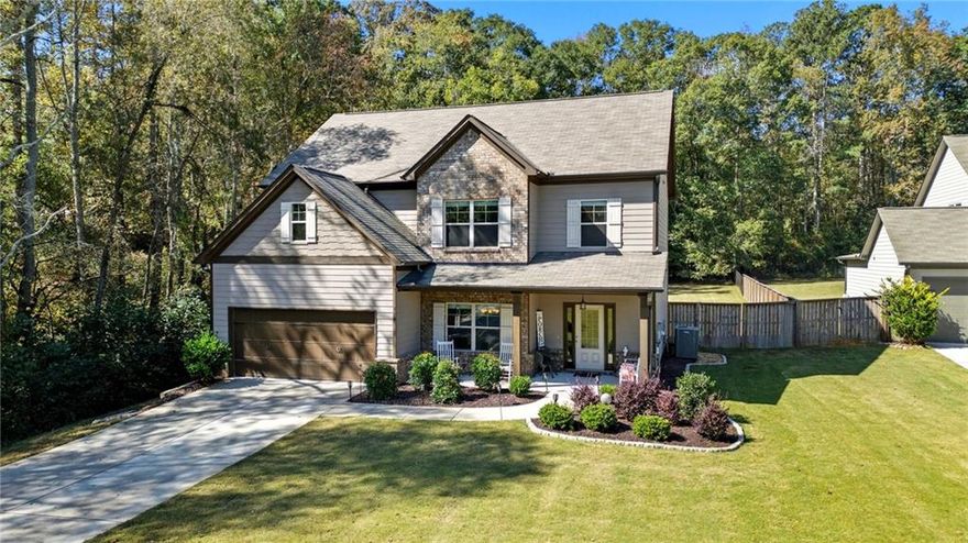 Set back from the street with a long driveway and welcoming covered front porch, this home blends everyday comfort with standout spaces for gathering. At the heart of the main level is a chef’s dream kitchen anchored by a large island and open sightlines to the family room—complete with a cozy fireplace. A separate dining room with a coffered ceiling elevates weeknights and holidays alike. The main-floor bedroom and full bath provide flexible use for guests, work, or multigenerational living. Upstairs, the oversized primary bedroom is a true retreat, leading to a spa-inspired bath with an oversized tiled shower and double vanity, plus an amazing walk-in closet. Two additional secondary bedrooms and a full hall bath round out the upper level. Outdoor living takes center stage in the flat, level, large backyard bordered by a creek—a private setting you’ll love. Enjoy year-round entertaining on the covered porch with fireplace, unwind in the covered hot-tub area, or host a crowd on the large deck. Thoughtful design, generous rooms, and multiple indoor-outdoor zones make this home easy to live in and effortless to love.