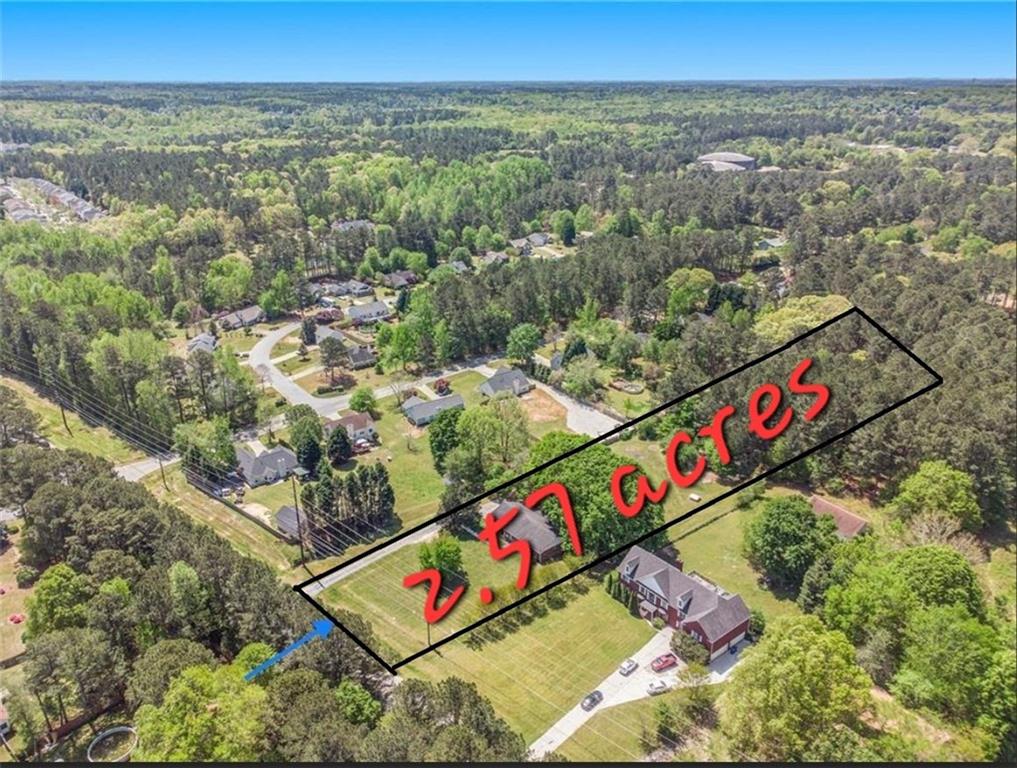 All Brick Ranch in Sought-After GRAYSON School District on 2.57 acres, Flat Style.w/Plenty of Space for PARKING, STORAGE, & PLAY! The POSSIBILITIES are Endless! Rocking-Chair COVERED FRONT PORCH Overlooking Relaxing Front Yard. ONE-LEVEL Living w/MASTER ON MAIN! The Great Room features a fireplace with a wood-burning insert. Office Space, 2-CAR GARAGE, and ADDITIONAL STORAGE! Enjoy the private backyard, 2-car side-entry garage, and a Storage Room. The Nice Front Porch has enough space for a swing or rocking chairs. Plenty of room for a garden, plus there are apple trees and a large wooded area at the back of the property. SPRAWLING LOT includes FRUIT TREES, PRIMITIVE BARN, & LIVESTOCK-FENCED AREA. Potential for ADDITIONAL HOMESITE at Back of Lot. Desirable area CLOSE to schools, new residential development, DINING/SHOPPING, Downtown Lawrenceville, Loganville, & Snellville!! Move-In Ready!