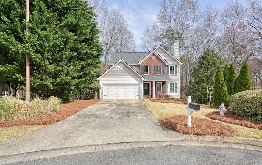 Priced Under $500K!!! Move-in ready and tucked on a quiet cul-de-sac in the sought-after Eagle Glen neighborhood, this 5BR/4BA home offers space, comfort, and privacy. The bright kitchen features granite countertops and white cabinetry, with carpeted bedrooms upstairs. The fully finished basement includes a large common area, bedroom, full bathroom, and extra storage—perfect for guests, in-laws, or a teen suite. Step outside to a peaceful, private backyard with shaded decks, a fire pit, and a tranquil creek. New HVAC system. Community includes pool, tennis, playground, and park. Close to downtown Woodstock, award winning schools, and shops.