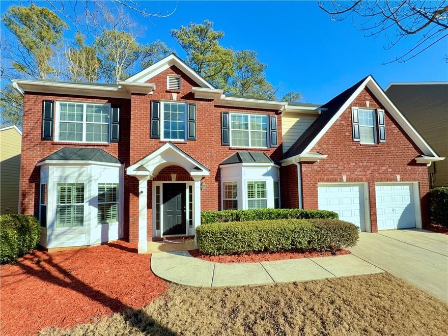 The pinnacle of elegance and comfort in this exquisite residence. Welcome to the crown jewel of Saddlebrook, the largest and finest home in the neighborhood, offering nearly 3,500 square feet of unparalleled luxury and craftsmanship. This stunning residence has been meticulously upgraded, showcasing custom features that elevate it far beyond builder-grade standards. As you step inside, you’re greeted by the 2 storey foyer, the timeless beauty of wide-plank hardwood flooring imported from Canada finished onsite, plantation shutters offering both elegance & privacy, a striking wrought iron decorative wood staircase. The gourmet kitchen is a chef's dream, featuring gleaming granite countertops, rich cherry wood cabinetry, stainless steel appliances, and a layout designed to inspire culinary creativity. The kitchen opens to a spacious great room, perfect for hosting gatherings, while the main level also offers formal living and dining rooms, an office/study, half bath and a conveniently located laundry room complete the main level. Upstairs, you'll find four generously-sized bedrooms and two full baths. The oversized primary suite is a true retreat, boasting a massive sitting area ideal for a library, home office, or relaxation space, along with an expansive walk-in closet. If you need an extra bedroom this huge bedroom can easily be sectioned and converted into a 5th bedroom. The spa-like primary bathroom features a soaking tub, separate shower, and dual sinks. Three bright and sunny secondary bedrooms and a full bathroom. Step outside to a beautifully landscaped, low-maintenance yard with a concrete patio, perfect for outdoor entertaining. Double attached garage for your convenience. A brand-new HVAC system, installed in August 2024, ensures year-round comfort. Ideally located near Dobbins Air Reserve Base, Truist Park & Cobb Galleria. A short drive to Hartsfield-Jackson International Airport, and Downtown Atlanta, this home offers convenience as well as luxury in equal measure. Don't miss the opportunity to call this exceptional property your own. Schedule your private tour today and experience the finest in Saddlebrook living!