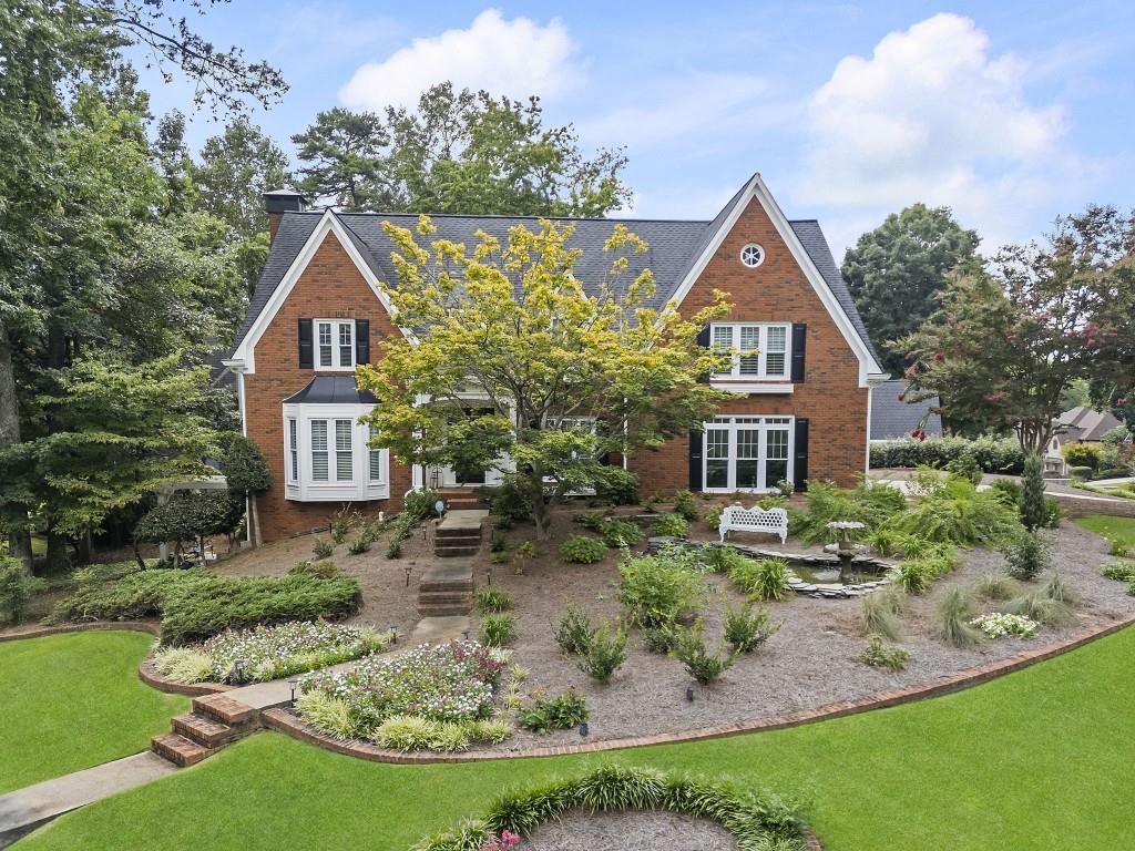 Welcome to this beautifully maintained former model home, featuring a rare and thoughtfully designed floorplan -- one of only a few like it in the community. Nestled within the highly desirable Brookstone Golf and Country Club neighborhood and zoned for top-rated West Cobb schools, this 5-bedroom residence offers space, comfort, and style. The main level includes a formal living room, formal dining room, and a warm, inviting family room perfect for relaxing or entertaining. The recently renovated kitchen boasts sleek Bosch appliances, updated cabinetry, stylish backsplash, and a spacious breakfast area. Upstairs, you'll find four generously sized bedrooms and two full baths, each tucked into its own private corner of the home. The luxurious owner's suite features a stunning spa-inspired bath with a newly tiled shower, soaking tub, dual vanities, and gleaming quartz countertops. The finished terrace level offers even more flexibility with an additional bedroom/office, a half bath, a large den or game room, and an extra space ideal for a home office or playroom. Step outside to a beautifully landscaped, fully fenced backyard -- perfect for outdoor enjoyment and privacy. This home reflects true pride of ownership and includes numerous thoughtful upgrades throughout. Brookstone offers an optional HOA with access to amenities such as a pool, tennis courts, playground, and a baseball field. Additionally, the optional Country Club features a championship golf course, restaurant, and clubhouse. Just around the corner are restaurants, a library, post office, shopping and more. Don't miss this unique opportunity to own a one-of-a-kind home in one of West Cobb's premier communities! Additional features: plantation shutters, hardwood flooring on main, brick exterior, luxury vinyl in the lower level, bay window,huge floored attic, whole house has been replumbed