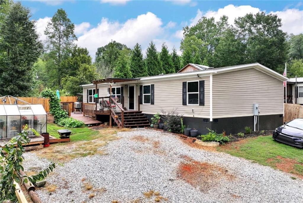 Don't miss this beautifully updated 4 bedroom, 2 bathroom mobile home located just steps from the lake and only 5 minutes from the Tugalo State Park boat ramp - perfect for boating, fishing, and relaxing by the water. Features include: Fresh interior paint throughout All-new flooring Stylish farmhouse sink Updated trim work Brand new privacy fence for added seclusion Spacious shop for storage or hobbies And so much more! Whether you're looking for a full-time residence, weekend getaway, or investment opportunity - this one checks all the boxes!