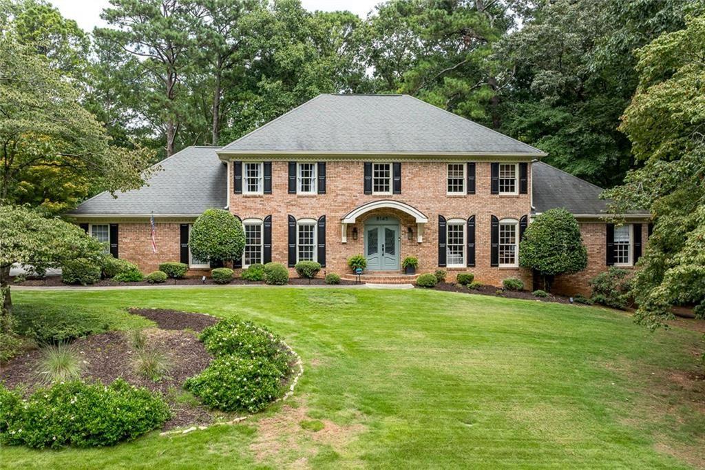 Exquisite All-Brick Masterpiece in Prestigious Rivergate! Welcome to this stunning, move-in ready home, perfectly situated on a beautifully landscaped 1.2-acre lot in the highly sought-after Rivergate neighborhood. Impeccably maintained and boasting a spectacular renovation, this all-brick residence offers timeless elegance, modern luxuries, and exceptional attention to detail. Step into the breathtaking two-story marble entry foyer, where natural light pours in and gleaming hardwood floors lead the way to a gracious living room with custom built-ins and a formal dining room. The newly renovated chef’s kitchen is a true showpiece, where the dining room flows seamlessly into a light-filled space featuring crisp white cabinetry, marble countertops, subway tile backsplash, and a large center island with breakfast bar. Top-of-the-line stainless steel appliances include a professional-grade gas range with pot filler and a microwave/convection oven, creating both beauty and function for everyday living and entertaining. A charming farm sink, bright breakfast area, and spacious walk-in pantry complete this culinary haven. The inviting, paneled family room is accented by a beamed ceiling, built-in bookcases, and a brick fireplace, with French doors opening to a slate patio that overlooks the private, wooded backyard—an ideal setting for outdoor entertaining or peaceful relaxation. The main level also hosts the luxurious owner’s suite, offering a serene retreat with a spa-like bath featuring dual marble vanities beneath a natural-light-filled skylight, a glass-enclosed shower, and a large walk-in closet. Rounding out the main level is stylish half bath for guests. Upstairs, a spacious landing connects to an additional primary suite with a beautifully renovated bath showcasing a dual vanity, frameless glass shower, and free-standing soaking tub. Two generously sized secondary bedrooms share a gorgeous hall bath. The spacious daylight terrace level expands your lifestyle possibilities with a game room, media area, office space, half bath, large laundry room, and abundant storage. Perfectly located in the Sandy Springs/Dunwoody area, this exceptional home offers convenient access to top-rated public and private schools, premier shopping and dining, recreational destinations including Dunwoody Country Club and Golf Course, and major interstates—placing all that Atlanta has to offer right at your fingertips. A perfect blend of timeless design, modern updates, and an unbeatable location—ready to welcome you home.