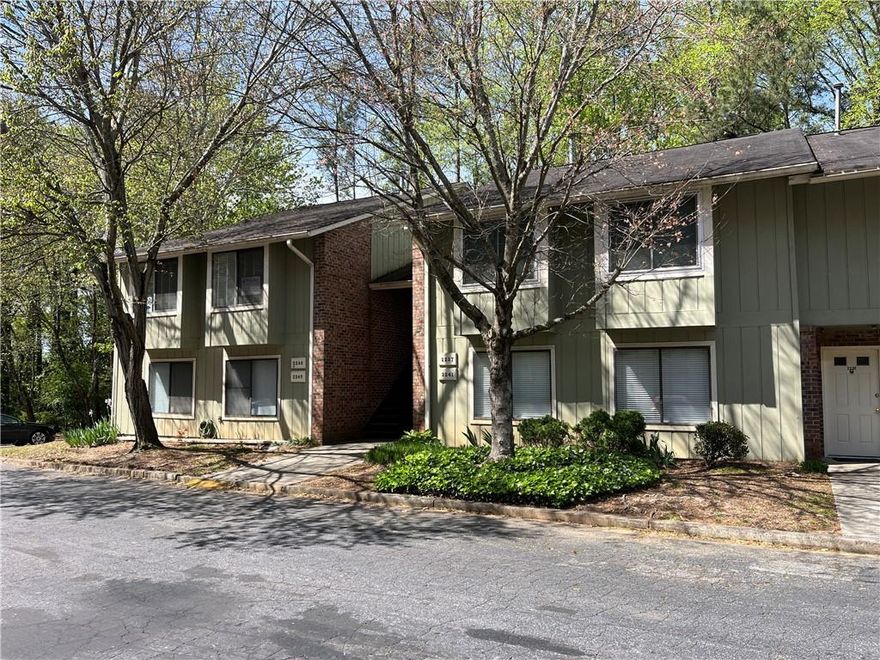 Imagine coming home and strolling on to your screened balcony overlooking a private, serene wooded view every day! What a way to unwind! Better yet, imagine meals, coffee or cocktails amidst an open kitchen w/ sight lines to the dining, living & balcony! Just added to this already upgraded condo with LVP flooring, carpet in bedrooms & new paint throughout. The kitchen includes a 5-eye gas range, built in microwave, dishwasher, side by side refrigerator, peninsula/breakfast bar and granite countertops. Lots of cabinets, prep area + 2-door pantry. The adjoining living / dining room has lots of space for entertaining & also features a beautiful working fireplace. Mount your TV and you have a great view from both the dining rm & kitchen. Master bedroom w/private bath & walk-in closet. Hall bathroom comes complete w/ heated tile floors. The attention to detail in this unit can't be fully described - even the lighting, additional outlets, water filter system can be upstaged by the built out attic that MUST be seen to be fully appreciated. Whole house attic fan. The balcony also features 2 storage rooms for even more storage. Community areas include dog-friendly spaces, swimming pool and walking trails.  Tenant pays $60 addtl each month paying towards HOA, Trash and water, for a total of $1755.
***For Rent, Lease Purchase or Sell*** 

NEARBY ATTRACTIONS: Grocery Stores (3 mins), Truist Park (10 mins), Marietta Sq (12 mins), I-75 (5 mins), Dobbins Air Force Base (19 mins)

LEASE PURCHASE TERMS: Call 

PETS: Possibly, call. 

EXTRA: Tenant pays $60 addtl each month paying towards HOA, Trash and water, for a total of $1755.
