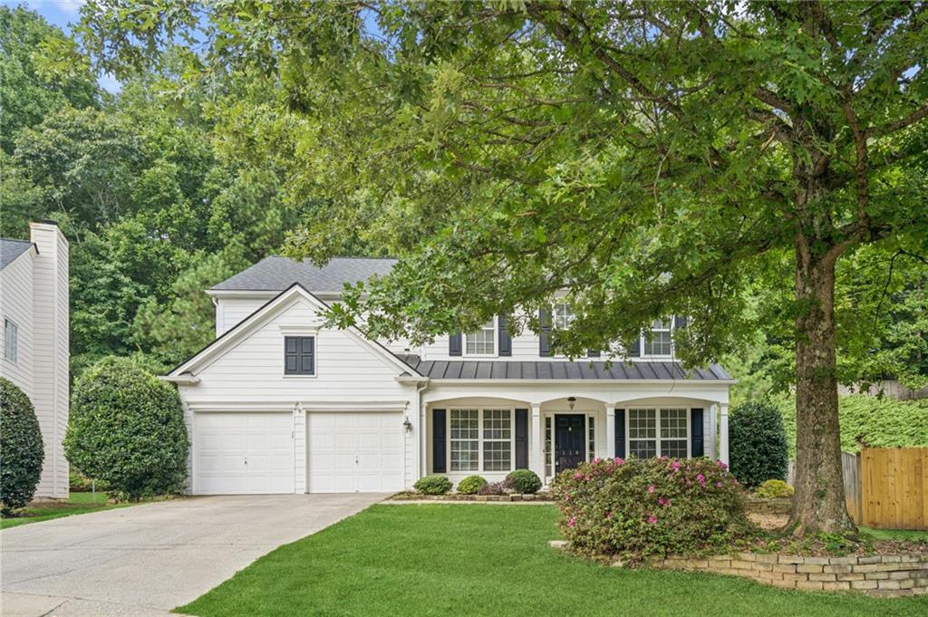 Nestled on a quiet cul-de-sac in The Glen section of coveted Woodlands neighborhood, this gorgeous traditional is the perfect blend of timeless elegance and modern living! A hidden coat closet disguised as an unassuming bookcase is the first surprise of beautiful woodworking detail throughout. Thoughtfully designed and freshly painted, the home features separate formal living and dining rooms, plus dedicated home office with custom built-in bookshelves and desk, recessed lighting, and coffered ceiling. An inviting family room with vaulted ceiling and striking built-in centers around a stunning stone fireplace and flows seamlessly into the eat-in kitchen. Lovely updated granite and stainless chef's kitchen is complete with an island, cozy breakfast nook, and walk-in pantry perfect for daily living and entertaining. Brand new carpet upstairs - including generous primary suite offering dual vanities, a soaking tub, separate shower, and large walk-in closet. Secondary bedrooms are spacious, including one with custom built-in window seat and share a charming full bath with dual sinks and a tub/shower combo. Step outside to a private backyard retreat featuring a stone patio and pergola, ideal for barbecues or relaxing and enjoying nature. Incredible resort-style community amenities include a clubhouse, pools, tennis courts, and walking trails, offering an active, connected lifestyle in an awesome location and more! Bonus: Qualified buyers may be eligible for discounted rate options and no-lender-fee future refinancing.