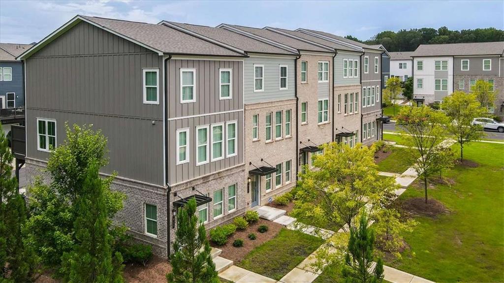 Nearly-New Townhome with Warranty Coverage, Prime Location & Modern Comfort - Waverly at Buice Lake Step into this nearly-new 3-story townhome, still under its 2nd year of 2-10 builder warranty as well as the structural warranty-offering peace of mind for years to come. Located in the highly desirable Waverly at Buice Lake community in Acworth, GA, this 3-bedroom, 2 full and 2 half bath home blends modern design with flexible functionality and a location that's hard to beat. The first floor features a versatile flex space-perfect for a home office, guest suite, workout area, or playroom. On the second floor, enjoy an open-concept layout with a spacious living room, dining area, and kitchen that flows out to a private deck, ideal for relaxing or entertaining. Upstairs, the third level hosts a generous primary suite with a walk-in closet and en-suite bath, along with two additional guest bedrooms and a second full bath. A convenient laundry area is also located on this level. All appliances-including washer and dryer-are included, making this home truly move-in ready. As part of Waverly at Buice Lake, you'll enjoy incredible amenities: pool, pickleball courts, playgrounds, clubhouse, scenic trails, and a tranquil lake. The HOA covers master insurance, exterior maintenance (including the roof), landscaping, trash and recycling services, and upkeep of all shared areas-giving you more time to enjoy your home without the hassle. And when it comes to location-you're just steps away from the charm of Downtown Woodstock, and only minutes from Kennesaw, Marietta, and I-75, making commuting and weekend plans effortless. This is your chance to own a like-new, low-maintenance home in one of Acworth's most vibrant and growing communities. Schedule your tour today!
