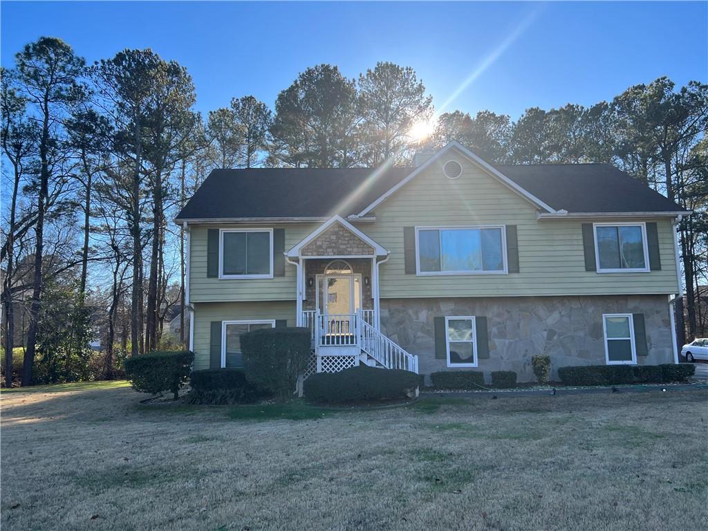 This wonderful Home is nested on 2 Acres corner lot in Powder Springs. Great Location! It offers 4 bedrooms ,3 full bathrooms, & open living room, Kitchen & Dining room all with hardwood floors. Wing door that opens to a double covered deck for Peace & Relaxation! There is additional space in the lower level that can be a Theater room, or Office with a full bathroom. Only the rear Storage Shed remains. Bring a little TLC for cosmetics & make this one Magical. Seller is offering a Carpet/Paint Allowance. No HOA or Rental Restrictions! Being Sold as Is.