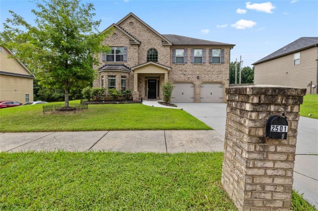 Luxury Living in Brittany Park - Over 3,500 Sq Ft of Elegant Space with Solar Efficiency - Welcome to Brittany Park, one of Ellenwood's most desirable and exclusive communities. This beautifully maintained 4-bedroom, 2.5-bath residence offers over 3,500 square feet of refined living space, seamlessly blending elegance, comfort, and energy efficiency-just 20 minutes from Atlanta Intown and Hartsfield-Jackson Airport. Step into a grand two-story foyer with soaring ceilings that set the tone for this thoughtfully designed home. The main level features a formal living room or flex space with a charming bay window, and a separate dining room enhanced by coffered ceilings-perfect for hosting guests in style. The chef's kitchen impresses with rich dark cabinetry, luxury vinyl plank hardwoods, a large center island, wraparound granite countertops, a breakfast bar, and a light-filled breakfast area overlooking the sunken family room. Step outside to a private, covered patio and fully fenced backyard-ideal for entertaining or quiet moments of retreat. Beautiful archways throughout the home add architectural elegance and flow. Upstairs, double French doors lead to the oversized primary suite featuring a spa-like bath with a soaking tub, separate glass-enclosed shower, and generous walk-in closets. Three spacious secondary bedrooms share a full bath with double vanities, offering comfort for loved ones or guests. Energy-saving solar panels add to the home's value and efficiency. And with no homeowners association, Brittany Park offers the freedom of homeownership in a well-kept, established community that is sure to impress. Enjoy close proximity to Ellenwood shops, dining, and major expressways-this is luxury, space, and convenience all in one exceptional home. This one will not last-schedule your private tour today!