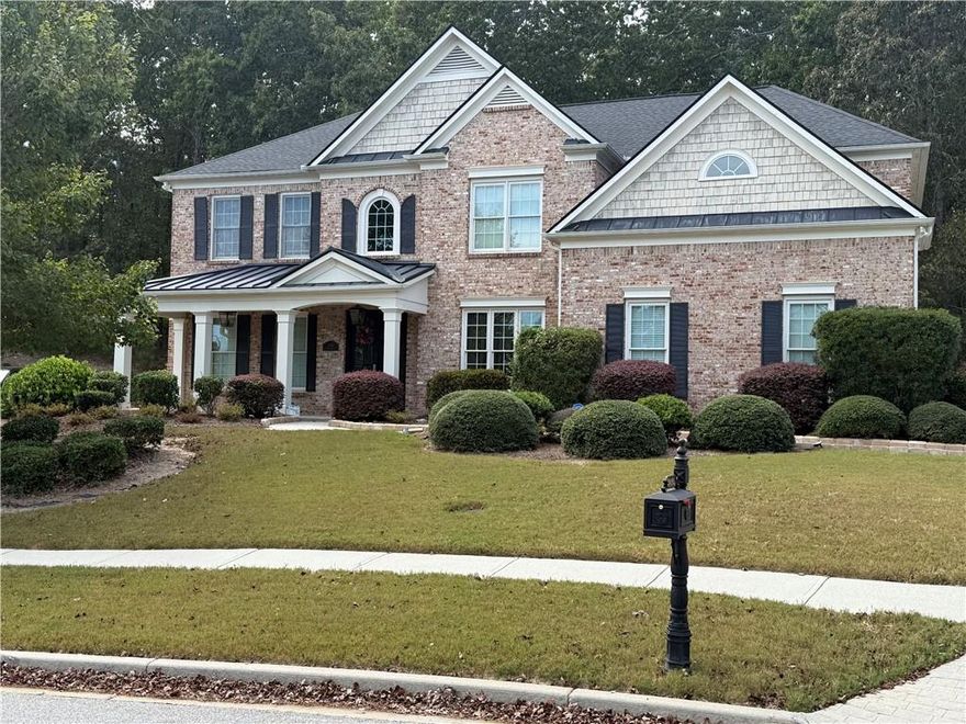 A dream home in the prestigious, private gated community of Walden Park this beautifully Designed 5 bdrm. 4 bath residence offers luxury, comfort and convenience-perfect for families and entertainers alike. Grand 2 story entrance foyer with abundant natural light, Expansive 2-story family room with floor to ceiling windows views of private backyard. Elegant hardwood floors throughout main level & guest bedroom. Chef-inspired kitchen featuring an oversized island, upgraded tile and backsplash, modern finishes. Stack stone fireplace in the family room for relaxing evenings. Spacious Owner's suite with trey ceilings, double French door entry, and a private sitting area - your own personal retreat. All 4 upstairs bedrooms include walk-in closets for maximum storage and organization. Just 29 minutes from Mercedes Benz Stadium, home of the Atlanta Falcons and host of the 2026 FIFA World Cup. 29 minutes to State Farm Arena where the Atlanta Hawks light up the NBA season. Only 41 minutes to Arthur Blank Soccer HQ in Fayetteville.