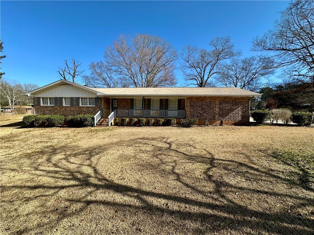 This beautifully renovated all-brick ranch at 1010 Wesley Park Drive in Marietta, GA, features a modern open floor plan with a brand-new kitchen and bathrooms. The home includes a new two-car garage and mature landscaping. It is situated in a safe neighborhood with excellent schools. Additional amenities include a large outdoor storage space, a washer and dryer, new flooring, cabinets, countertops, a new HVAC, and stainless steel appliances.