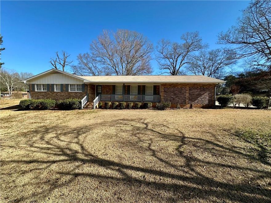 This beautifully renovated all-brick ranch at 1010 Wesley Park Drive in Marietta, GA, features a modern open floor plan with a brand-new kitchen and bathrooms. The home includes a new two-car garage and mature landscaping. It is situated in a safe neighborhood with excellent schools. Additional amenities include a large outdoor storage space, a washer and dryer, new flooring, cabinets, countertops, a new HVAC, and stainless steel appliances.