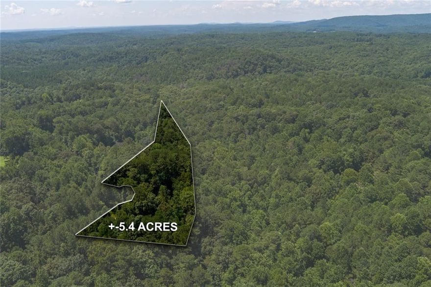 5.4 Beautiful Acres for sale. Close to Downtown Canton, Zoned agricultural. One mile from Reinhardt University and downtown Waleska. Already graded for basement lot on one side. Level area on the other side for a slab. Bring your vision and imagination because this beautiful piece of property is amazing and has tons of potential. You can build big or small. So many options! Perc test available. Water available across the entire property. 500 ft. of road frontage, gravel driveway, lot is located on gravel road. Property includes ownership of the road plus 20 feet across the street. Shallow stream runs along back of the property. Woods all around, very private and peaceful. Quiet, dead end road with only 3 other houses on 5+ acres lots. NO HOA!