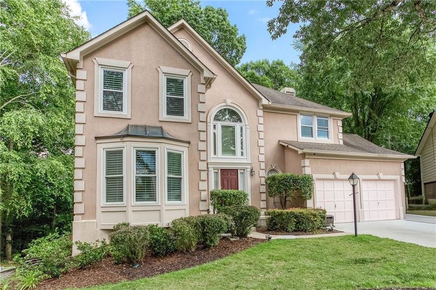 AMAZING LOCATION in EAST COBB!!! You just found your home! Ideally situated near HWY 285 and HWY 400, this stunning property is nestled in a sought-after neighborhood within the highly acclaimed Walton High School district. Enjoy easy access to top-tier dining, shopping, and the scenic Chattahoochee nature trails — with direct access to hike or walk to the Chattahoochee River Preserve.  Set on the largest lot in the development, this home offers a park-like setting with professional landscaping, perfect for family and friends gathering where memories are made.  Inside, discover sophisticated charm and high-end renovations throughout.  The beautifully renovated kitchen is a dream, complete with quartz  countertops, white cabinetry, a tile backsplash, stainless steel appliances, and a gas range. It flows seamlessly into the dramatic two-story family room.  New driveway. Bonus room in the basement is perfect for a 5th bathroom, play room, office space...many possibilities. Located just minutes from Papermill Village, with charming shops, dining options, and a weekend farmers market (during normal times), this boutique community offers a blend of privacy, convenience, and access to some of East Cobb’s best amenities. This gorgeous home sits in a cul-de-sac quiet location, yet, it is close to everything you need. Start packing and be ready for your new beginnings in your home sweet home!