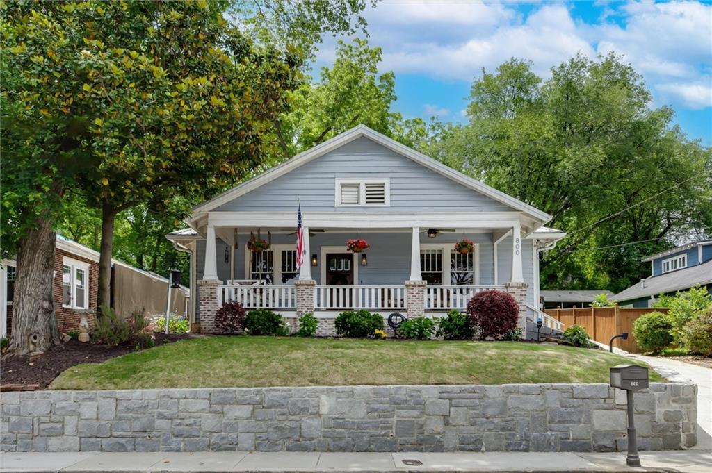 COME SEE this great bungalow home in the historic Berkeley Park neighborhood of Atlanta, established 1921. You’ll be greeted by a beautiful front porch with lots of space for entertaining or lounging. The family room of the home greets you as you walk in the front door, with tall ceilings, gleaming hardwood floors (continued throughout the home), and lots of natural light. The dining room has ample space for your dinner parties, allowing seating for 12+. Kitchen has been updated with granite countertops, SS appliances, white cabinets, soft close drawers, and a built-in pantry. The amount of cabinets in the space make for plenty of storage for all of your kitchen needs. Spacious owner’s suite with updated bathroom - double sinks, tile floors, & clawfoot tub/shower. Additional 2 bedrooms share the hall bathroom, which has been completely remodeled. This 2nd full bath is equipped with a new vanity, new tile floors, new large shower with Showerguard glass, and luxurious rain shower head. Back bedroom has been equipped with extensive additional closet space for all of your clothing or storage purposes. LOTS OF ADDITIONAL ATTIC STORAGE. Enjoy time outdoors on the back patio or in the lush backyard. Shed in the back for additional outside storage. Privacy fence surrounds the property. Off street parking available with 2-car carport through the private, electronic security gate. The Upper West Side home is in an ideal location – close to the Beltline (included in Beltline expansion project), Top Golf, and The Works with easy highway and airport access. DON’T MISS THIS ONE!