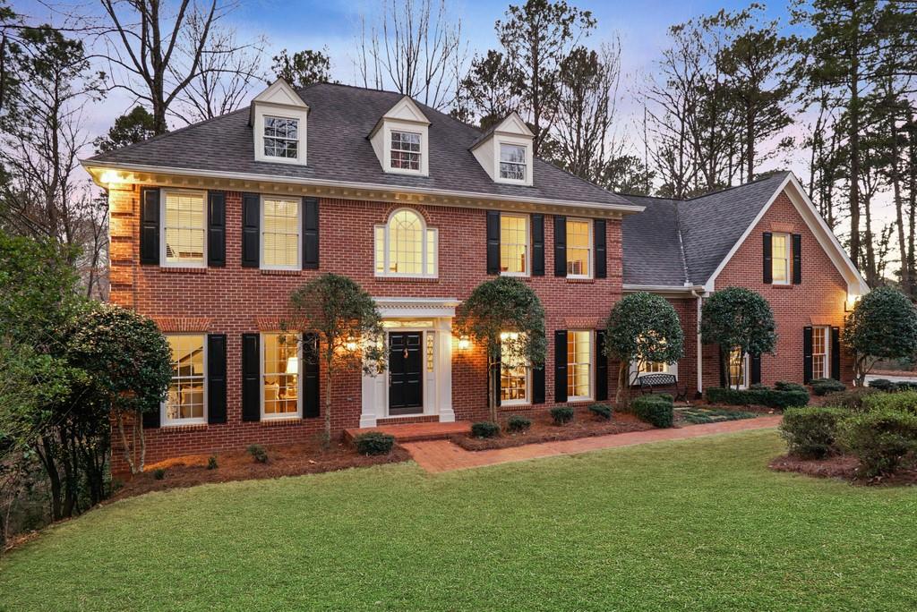 Elegant and Recently Updated 4-Sided Brick Executive Home on a private, professionally landscaped, 1.4 Acre wooded cul-de-sac lot in highly desirable Sandy Springs. High quality and classic finishes include true-divided light architectural windows throughout, judges paneling, hardwood floors, designer color palette, abundant wainscoting and dentil molding. The grand 2-story entry foyer is flanked by a banquet-sized dining room and spacious living room. The vaulted great room has fireplace and wetbar and boasts a 2-story wall of Palladian windows. Recently updated gourmet kitchen features Viking and Kitchen Aid appliances, island with bar seating, and 2 walk-in pantries. Excellent connection to the outdoors with light-filled keeping room, screened porch and open deck overlooking the wooded landscape and creek. Home office, 2 half baths, and mudroom and laundry complete the main level. Over-sized owners’ suite has tray ceiling, 4 closets, and newly renovated owners’ bath has separate vanities, tile shower, and garden tub. Three additional oversized bedrooms and two baths also found on the upper level. Finished terrace level has expansive media and game room with fireplace and full bath. Over 1000 sqft of unfinished space has double service doors and has plenty of room for storage and workspace. Excellent lifestyle location only steps from Cherokee Country Club or Huntcliff Club’s Swim, Tennis and Stables Amenities and very close to 400/285, Downtown Roswell, and Chattahoochee River Park.