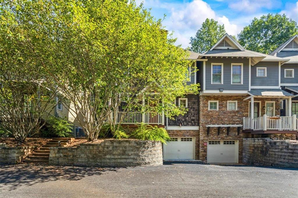 Welcome to The Seasons, one of Athens’ most sought-after condominium communities! This stunning 3-story Craftsman-style, end-unit townhome offers the perfect blend of elegance, functionality, and convenience—just 5 minutes from Sanford Stadium and 10 minutes to downtown Athens.
The terrace level features a one-car garage and a spacious storage area, offering plenty of room for practical needs or hobby storage.
On the main level, enjoy an open-concept design with 9-foot ceilings and beautiful hardwood floors. The chef’s kitchen is stunning, showcasing granite countertops, tile backsplash, a large eat-in island with seating, stainless steel appliances, a gas cooktop, custom cabinetry with built-in under- and over-cabinet lighting, and a generous walk-in pantry. A separate dining area with built-in display cabinet flows seamlessly into a cozy den anchored by a gas-log fireplace and built-in bookshelves—ideal for gathering or relaxing. French doors open to a private concrete patio, perfect for entertaining al fresco.
The upper level is bright and inviting, thanks to a wall of windows and soaring ceilings along the staircase. The owner’s suite impresses with two expansive closets, one featuring custom shelving, and a luxurious bathroom with dual vanities, jetted tub, and a large walk-in shower with pebble-style tile flooring. A thoughtfully designed desk nook in the guest bedroom adds versatility, while brand-new carpet graces bedrooms and hallways. A convenient laundry room includes washer / dryer hookups and storage cabinetry. Finally, for peace of mind, a complementary 1 year home warranty is being included with this home. The Seasons feels like a peaceful woodland retreat while offering in-town convenience. Residents enjoy a quiet, well-maintained environment surrounded by mature trees and greenery, with minimal exterior maintenance required thanks to HOA care. The Seasons is just minutes from UGA, the Vet School, downtown Athens, and Five Points—making it the ideal blend of natural setting and access to urban amenities.