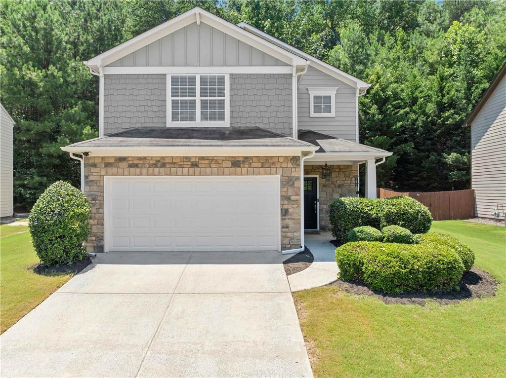 Located just one mile from Lake Lanier, this beautifully maintained home is situated in the highly desirable community of Sugar Hill. The open-concept floor plan features a spacious dining area and an eat-in kitchen with granite countertops—perfect for both everyday living and entertaining. The main level includes a versatile bedroom that can also function as a home office or guest suite. Upstairs, a large landing offers additional flexible space—ideal for a second office, playroom, or media area. This low-maintenance property is part of an active HOA community with swim and tennis amenities. With ample living space, stylish finishes, and a prime location near Lake Lanier, this home offers the perfect blend of comfort, convenience, and lifestyle.
