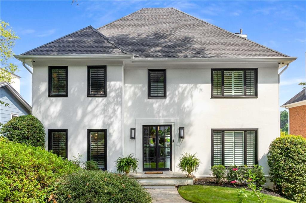 This home is perfectly positioned in the highly sought-after coveted Morningside school district in a neighborhood offering unbeatable walkability to the serene Morningside Nature Preserve, Sprouts, Piedmont Park, Top restaurants like 6 feet Under, The Colonnade, Ninos Italian, Taqueria de Sol. As you drive up you will marvel at the curb appeal the home exudes with Modern double Black Iron doors, New black windows and plantation shutters offers sophistication and elegance to the home. You will be greeted with warmth from the incredible light-filled brightness as you enter the foyer with a view of the spectacular wall to wall Panoramic bifold doors in the great room leading to a large backyard patio ideal for entertaining. The spacious layout boasts a gracious living room with shelving and built-ins, gas fireplace, separate dining room, formal living or flex space for office. Beautiful hardwood floors throughout & double crown molding. The heart of the home offers white kitchen cabinets, quartz countertop, white modern backsplash, SS appliances with Gas cooktop, breakfast area with custom built-ins for extra storage. Retreat upstairs to relax in the oversized private primary suite with an envious custom walk-in closet that is just to die for as well as another additional closet, Large spa-like ensuite bath featuring soaring vaulted ceilings, double vanities, soaking tub, and separate shower and private water closet. To complete the upstairs there are 2 additional generous secondary bedrooms and updated hall bath with double vanity, tub/shower combo. The floorplan ensures space and comfort for family or guests. Downstairs offers a fully finished terrace level with room to use as another bedroom, office or theatre and Full bath. Enjoy an abundance of natural light in the day-lit basement. Walk outside you will find an attached 2 car garage and an Additional Rare detached 2-car garage or Workshop with 220 voltage. Don’t miss your chance to live in one of Morningside’s most beloved neighborhoods and call it HOME.