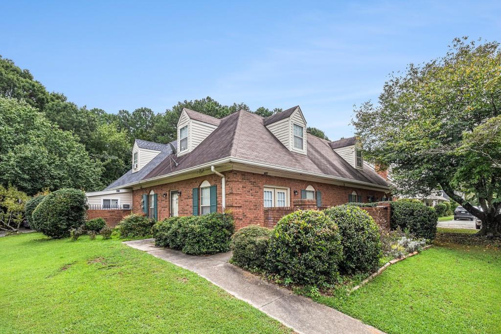 Updated Brick End Unit Townhome that Lives Like a Single Family Home in the Heart of Conyers! Perfectly located near Pine Log Park, beautiful gardens, multiple parks, Shopping, and Dining. Step inside to discover Tall Ceilings, Elegant Crown Molding, Gleaming Hardwood Floors, and a Stunning Brick Fireplace as the Centerpiece of the Living Room. The Light-Filled living room offers the ideal space for both Entertaining and Relaxing. The Open Kitchen showcases stylish Two-Toned Cabinets, Stone Countertops, Stainless Steel Appliances, and room for a Cozy Breakfast Table, with Direct Access to the Private Deck perfect for al fresco dining. A Spacious Bedroom on the Main Level, complete with a Full Bathroom and Laundry Hookup, makes an Ideal Guest Suite, Home Office, or Playroom. Upstairs, the Large Primary Bedroom features an Ensuite Bathroom with a Walk-In Shower, Stone Vanity, and Walk-In Closet. Conveniently Located with Easy Access to I-20 and Just Minutes to Olde Town Conyers' Charming Shops and Restaurants. Don't Miss the Opportunity to Own a Home That Perfectly Combines Comfort, Style, and an Unbeatable Location!