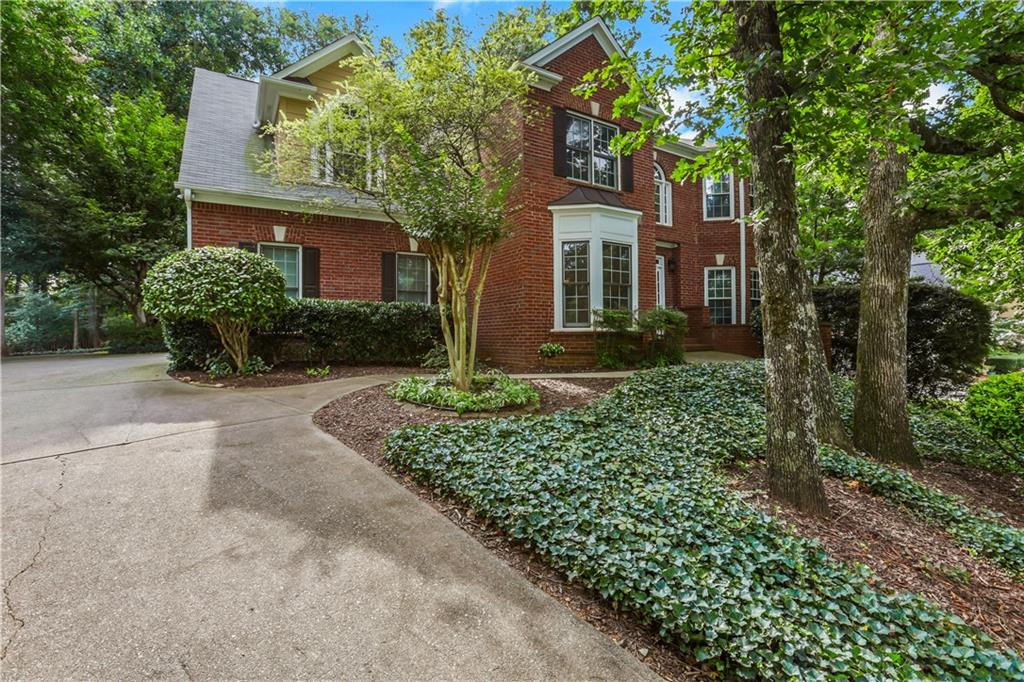 Charming 5 bed 3 and half bath home, located in a quiet neighborhood in West Forsyth, close to 400, The Collection, local parks, restaurants and so much more! This home features a beautiful freshly painted kitchen with granite counter-tops, stainless steel appliances, white cabinets, breakfast nook, and opens up to a spacious family room. Right off the breakfast nook is the screened in porch and amazing private backyard great for entertaining. This home also has a finished basement with a full bed and bath, living area, and bonus unfinished space for home office, gym, or storage. Large primary suite with a spacious bathroom and beautiful vaulted ceiling, three additional generous sized bedrooms. Move in ready! You won't want to miss this!